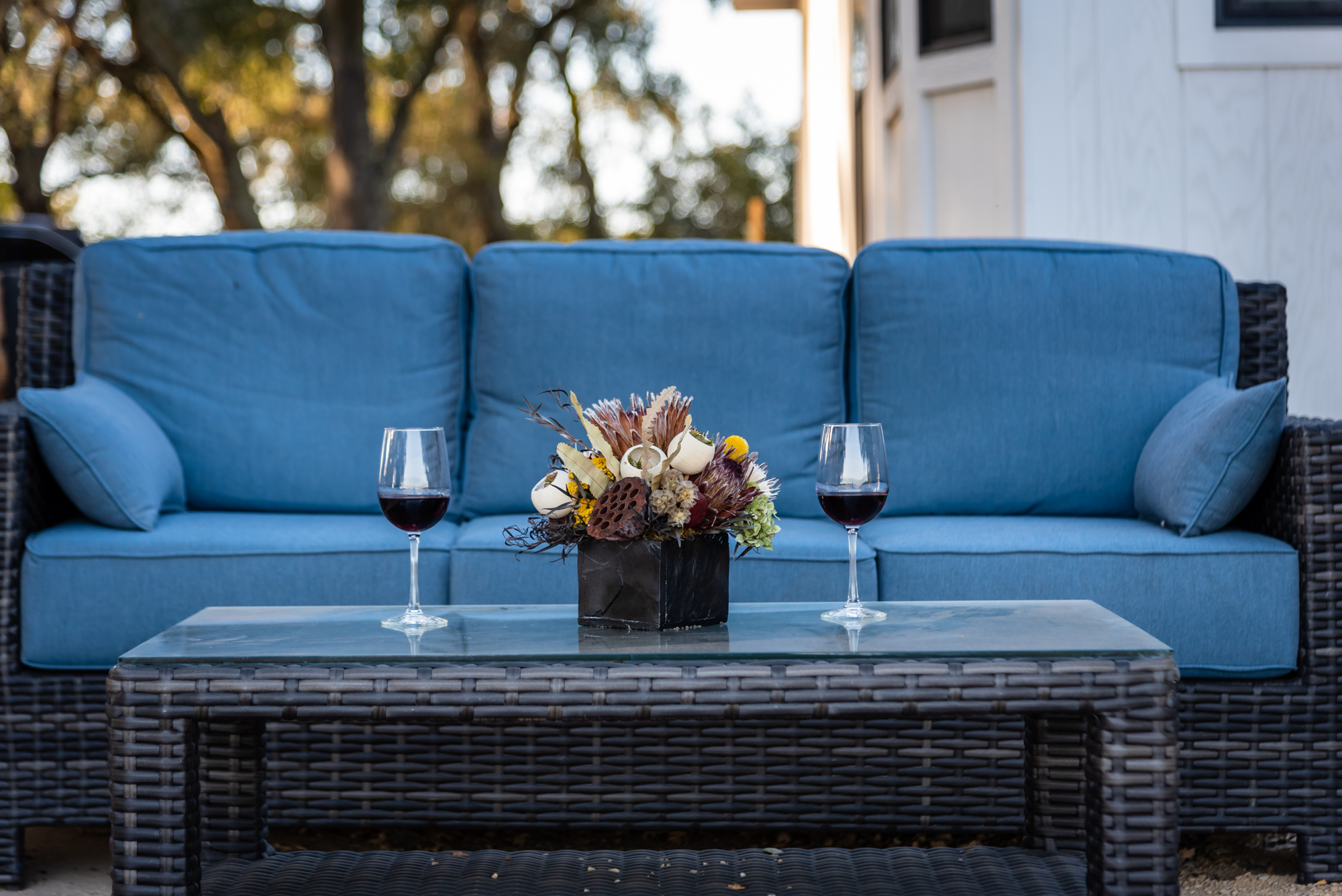 Relax with a drink on our comfortable woven sofa.