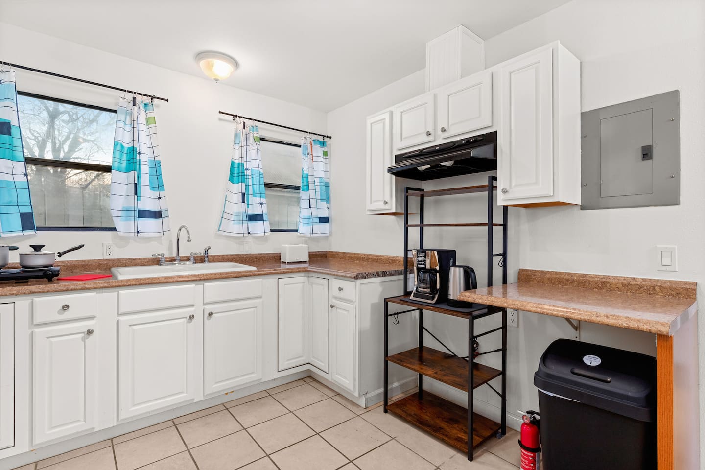 Savor the comfort of home cooking in our charming kitchen, complete with everything you need for culinary adventures and cozy meals.