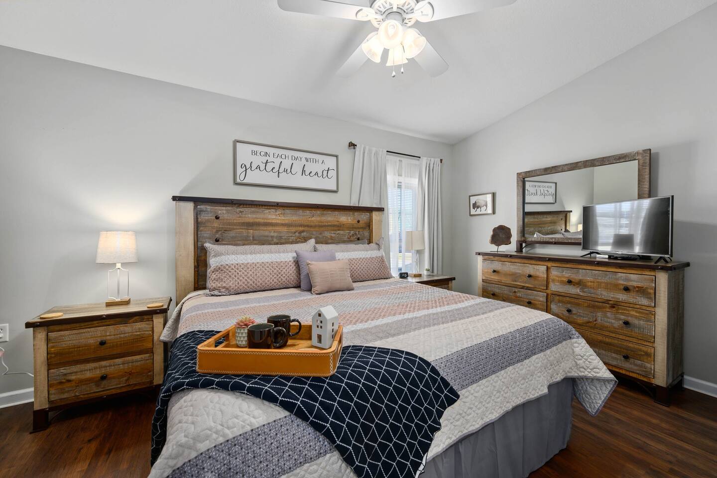 Our master bedroom features a king size bed, a sitting bench, and a walk-in closet. 