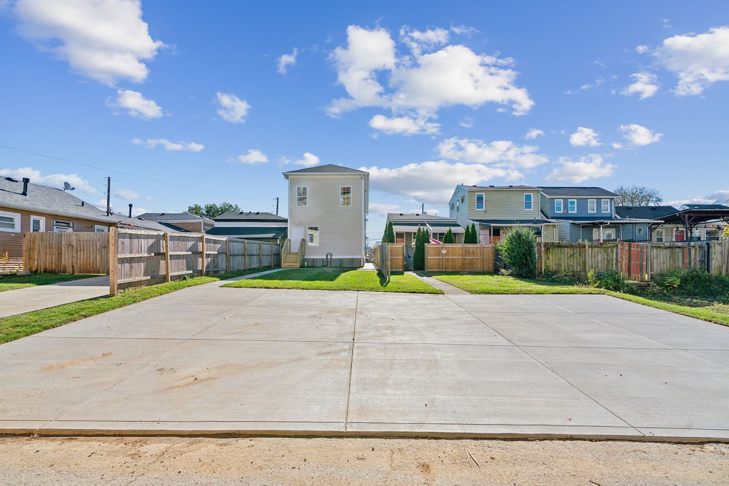 Large parking pad in the back. Park to the left side of the parking pad. 