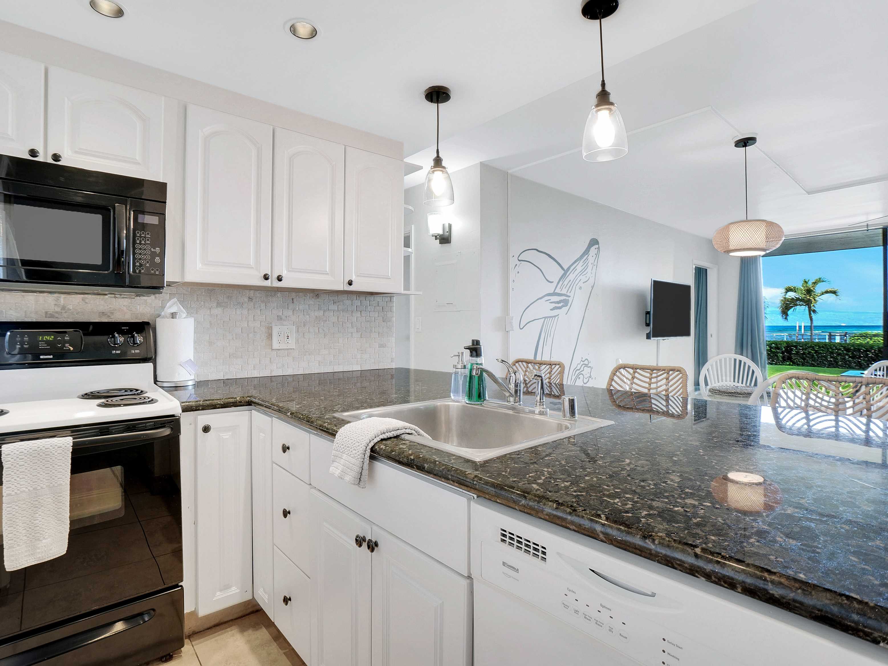 Spacious kitchen, equipped to cook up all your favorites! Plus, you can be a chef with a view!