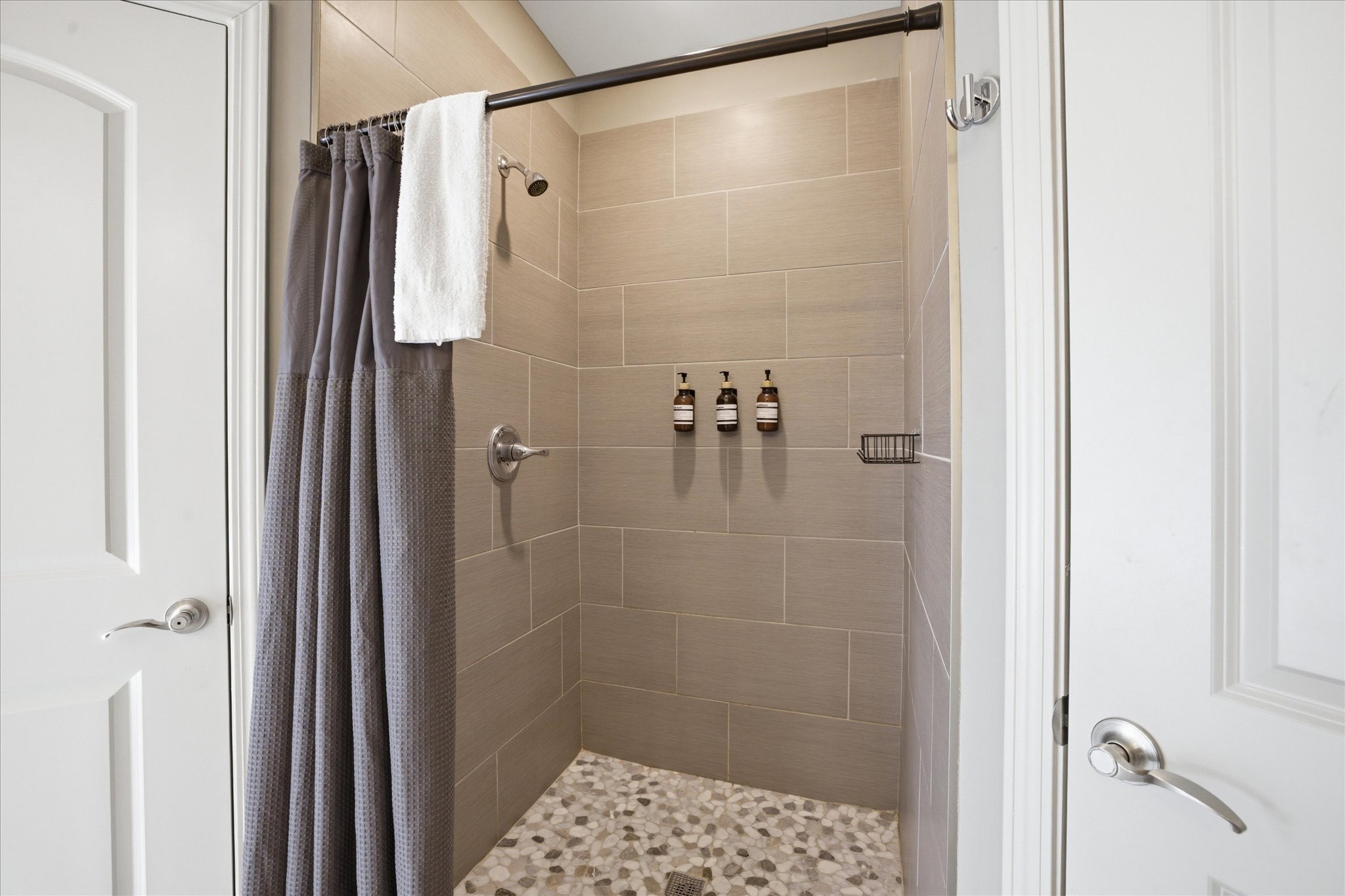 The walk-in shower in Unit 1 is built for a full reset—clean lines, plenty of space, and a simple setup that makes stepping in after a long day feel easy and comfortable.