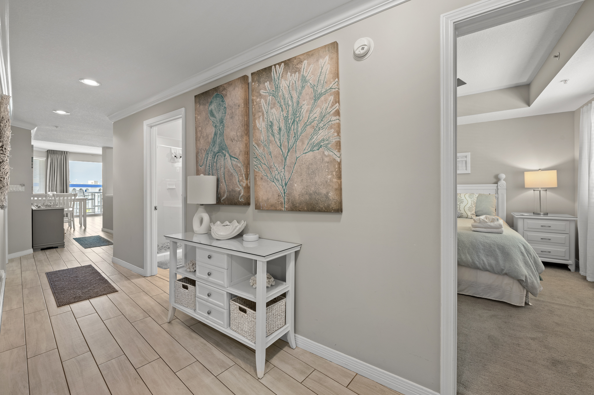 Cozy bedroom corner w/ artwork and soft lighting for restful nights.