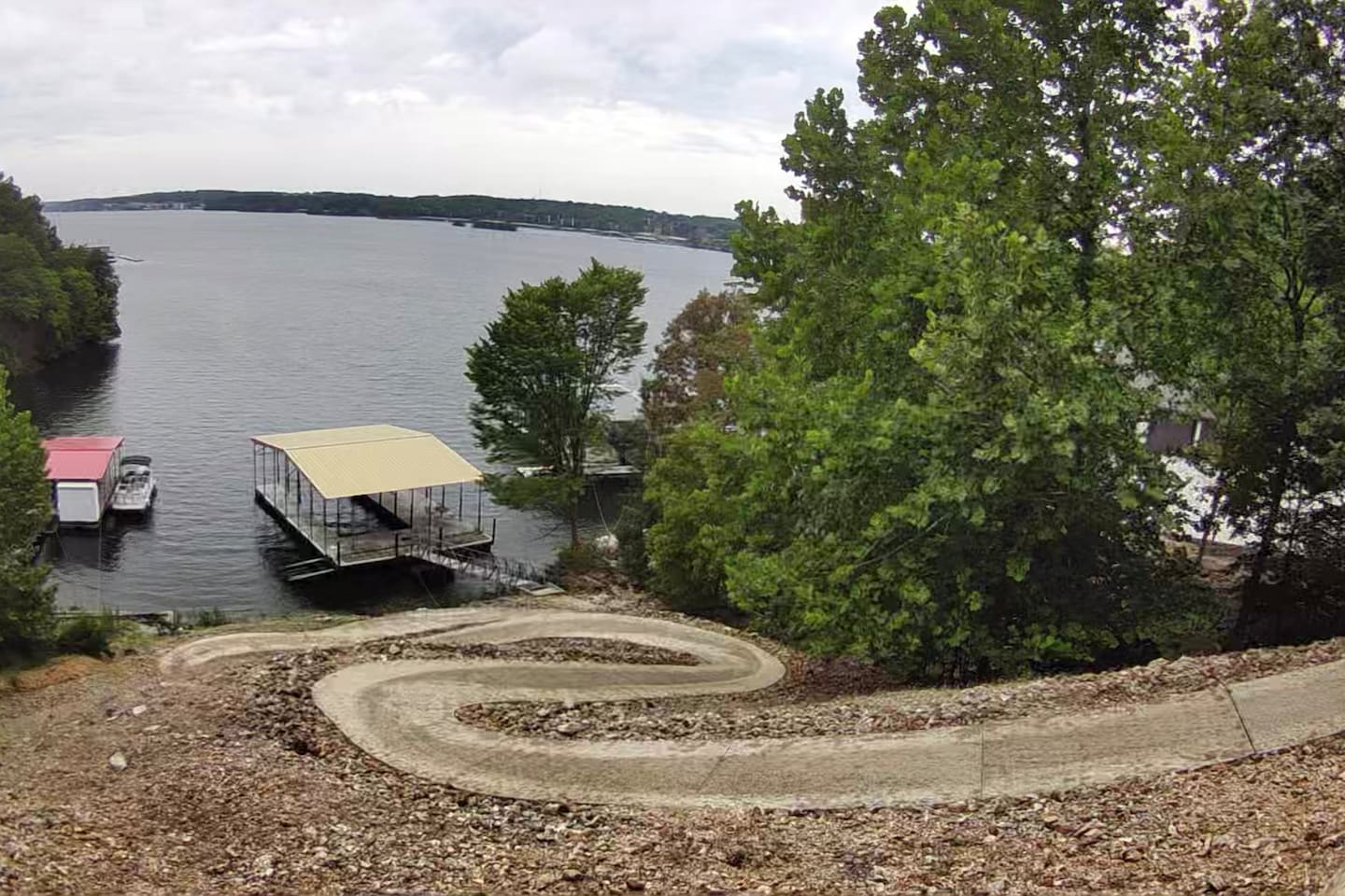 The walk to and from the dock is rather steep. We are working on finding a solution to relandscape. Only the physically fit will be able to walk this pathway to the dock. 
