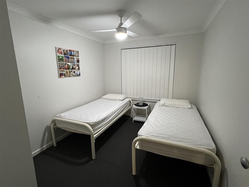 Bedroom 3 with 2 single beds and built-in robe