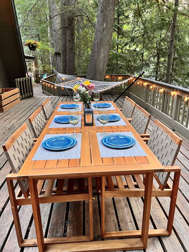 Dining and lounging area on deck overlooking the river
