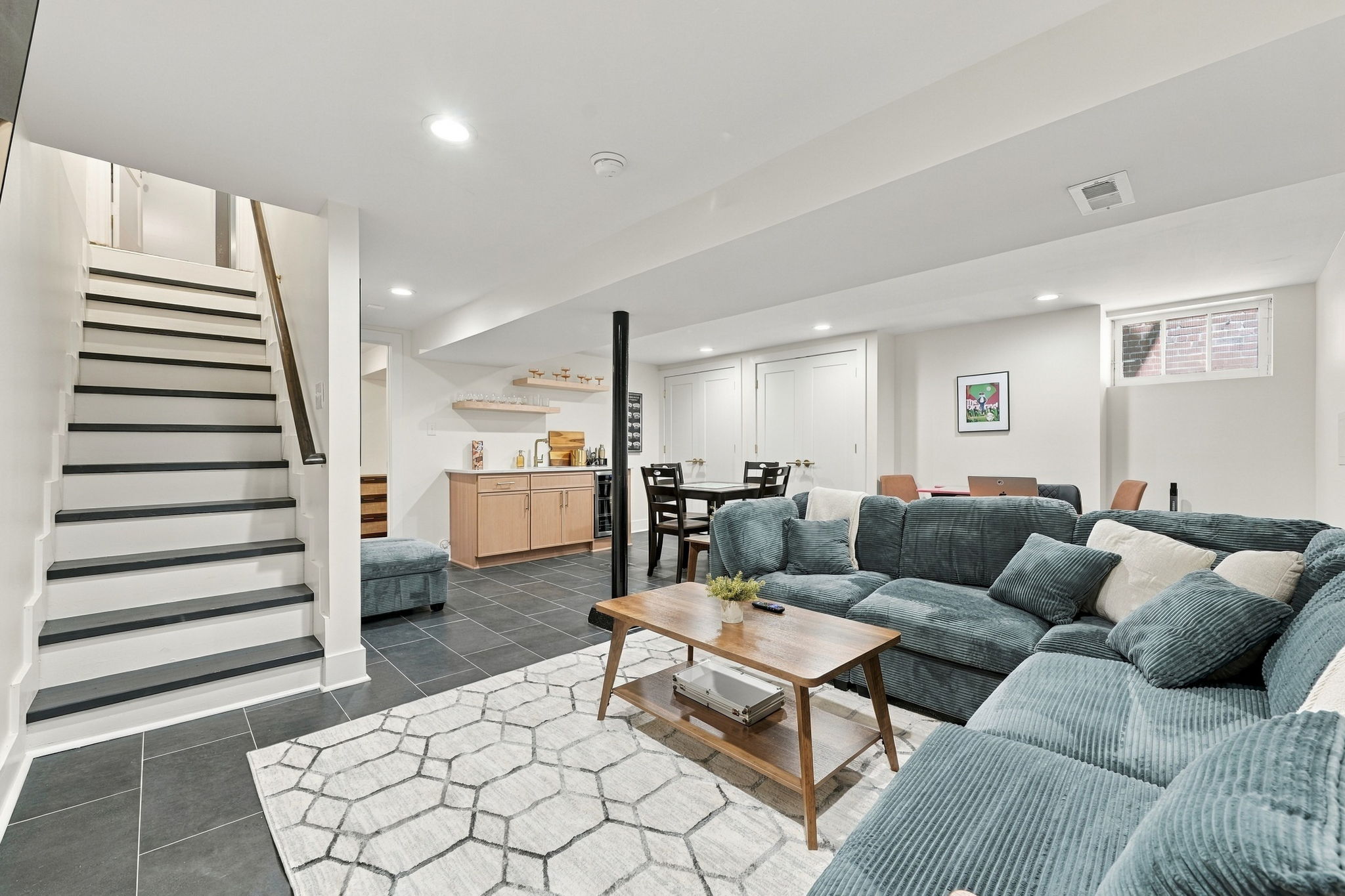 Living Area: Bright and inviting space with plush seating and a modern kitchenette for gathering!

