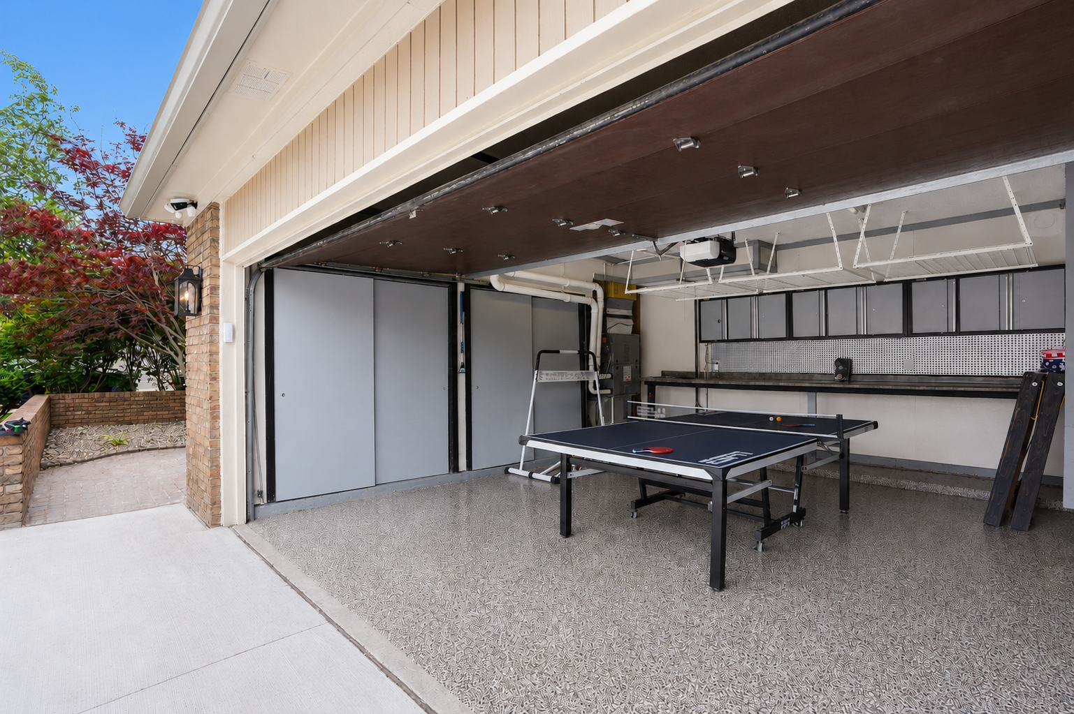 The covered patio area further expands the usable square footage, creating an inviting outdoor extension that seamlessly connects the indoor and outdoor living spaces.