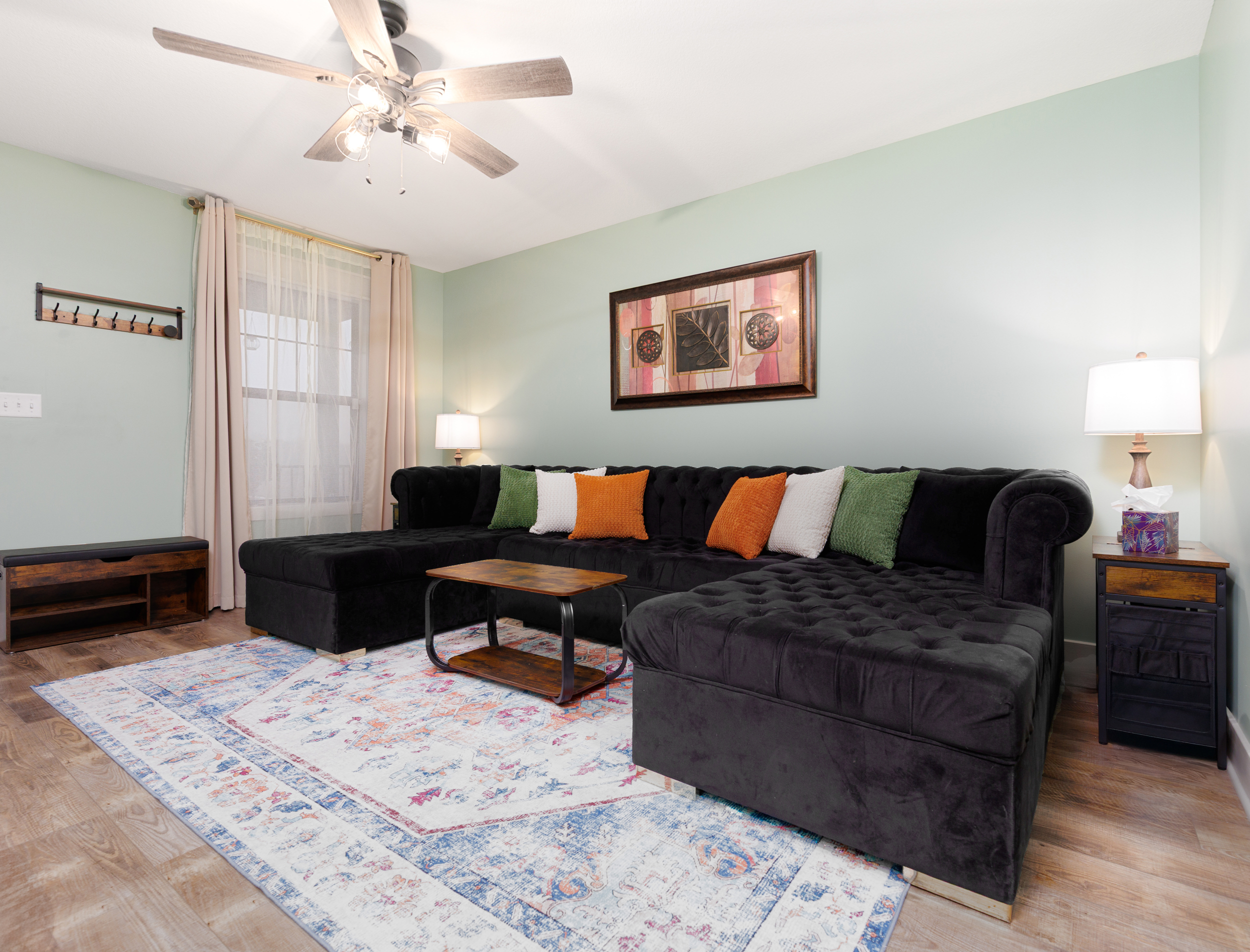 Inviting living room designed for gathering, relaxing, or enjoying a movie night. Comfortable seating and an open layout make it easy for everyone to spend time together.
