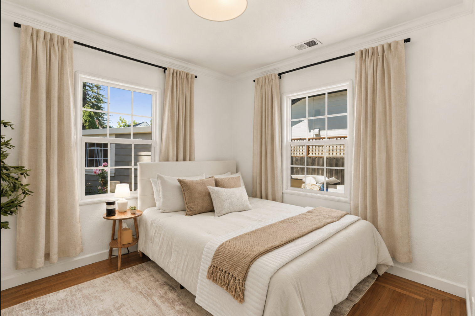 Comfortable queen bedroom with abundant natural light