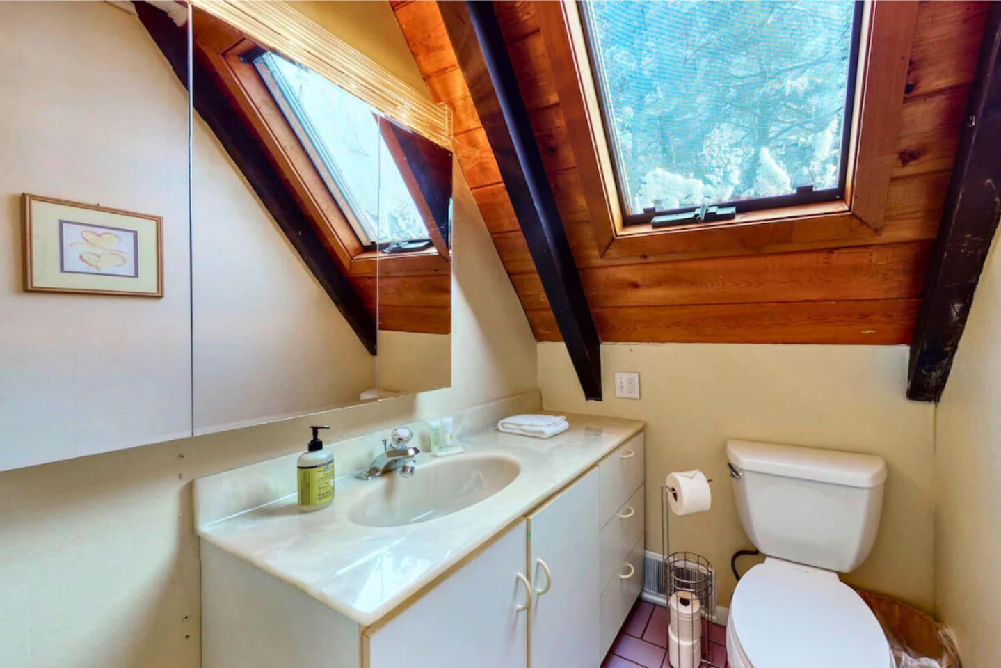 Full bathroom on the second floor of this cozy lakeside cabin!