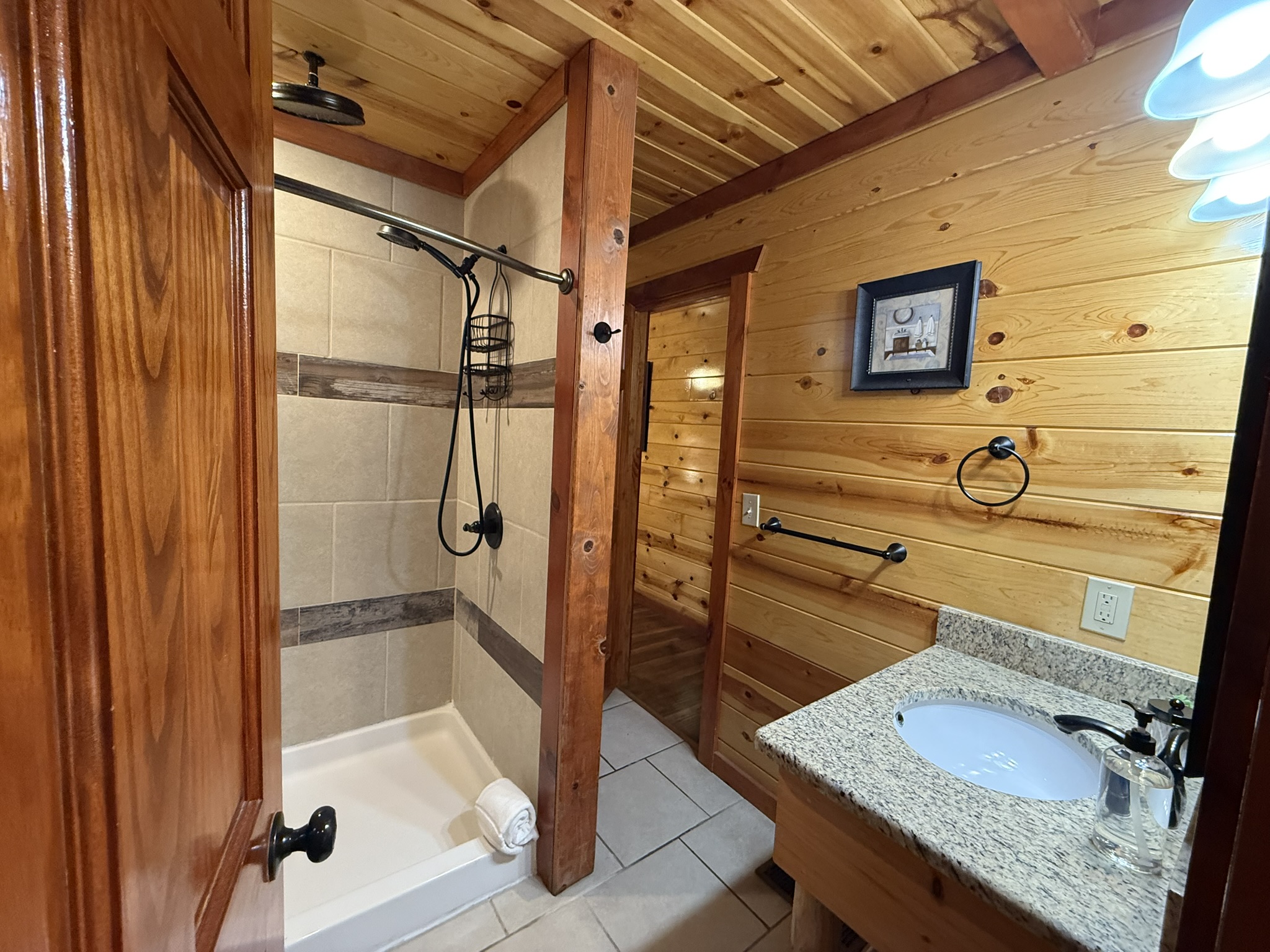 Perfectly positioned ensuite bathroom featuring a spa-like shower with luxurious dual rainfall showerheads.