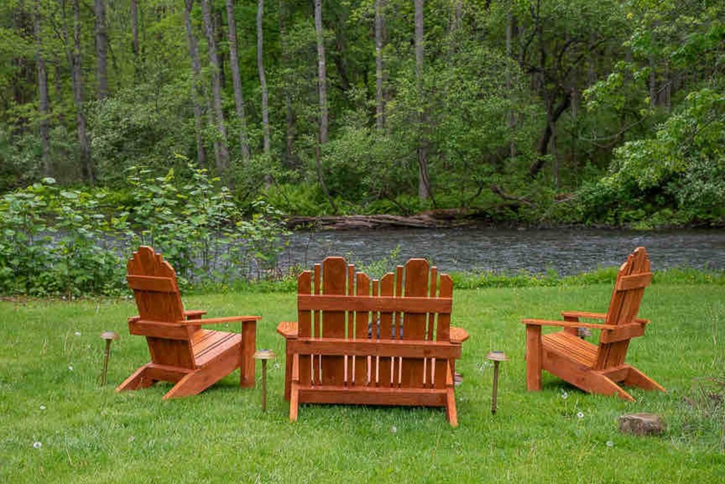 Locally handmade Adirondack chairs at the bonfire in front of the creek. Need I say more ? ❤️❤️