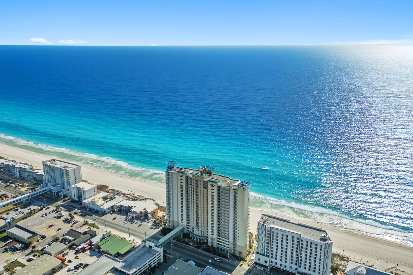 Aerial view of Aqua Resort, a beachfront condominium complex.