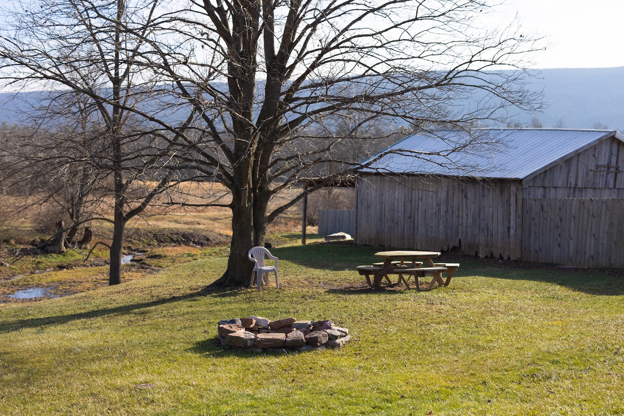 Firepit area and picnic table to enjoy the outdoors