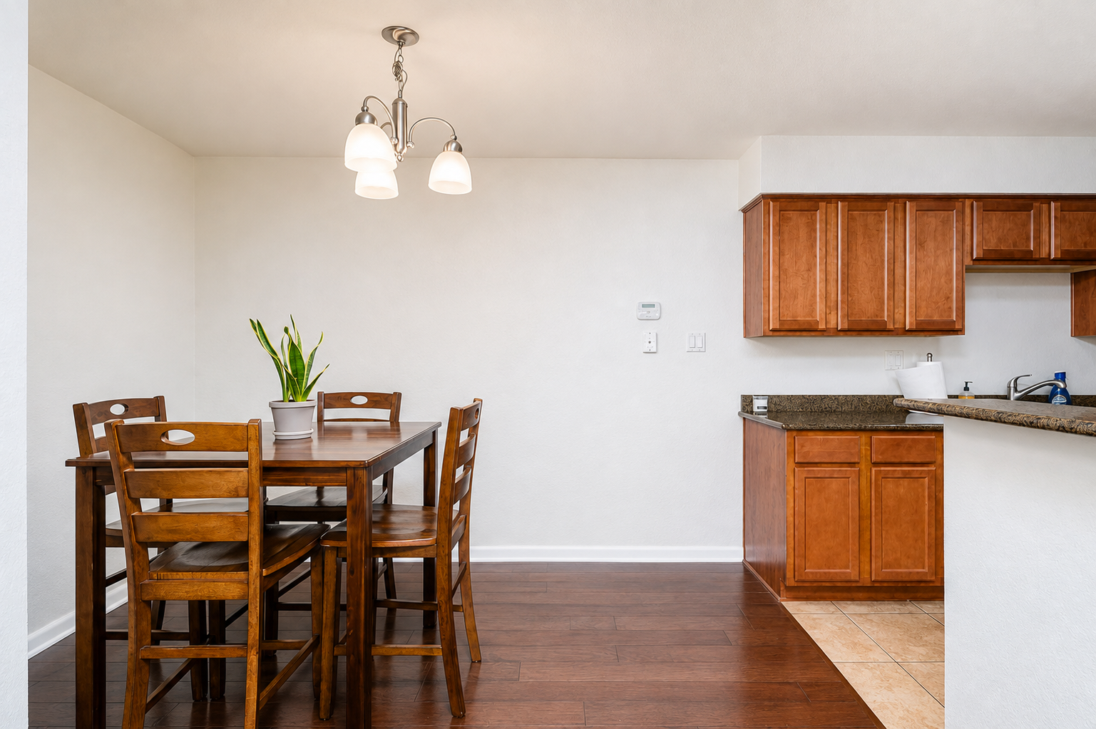 Simple dining setup near the kitchen for everyday meals during your stay.