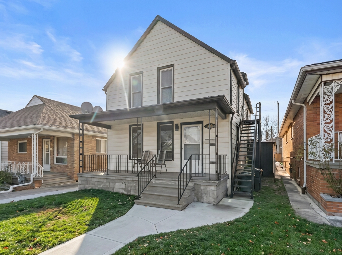 Front of the property showing the staircase to the upper unit. 