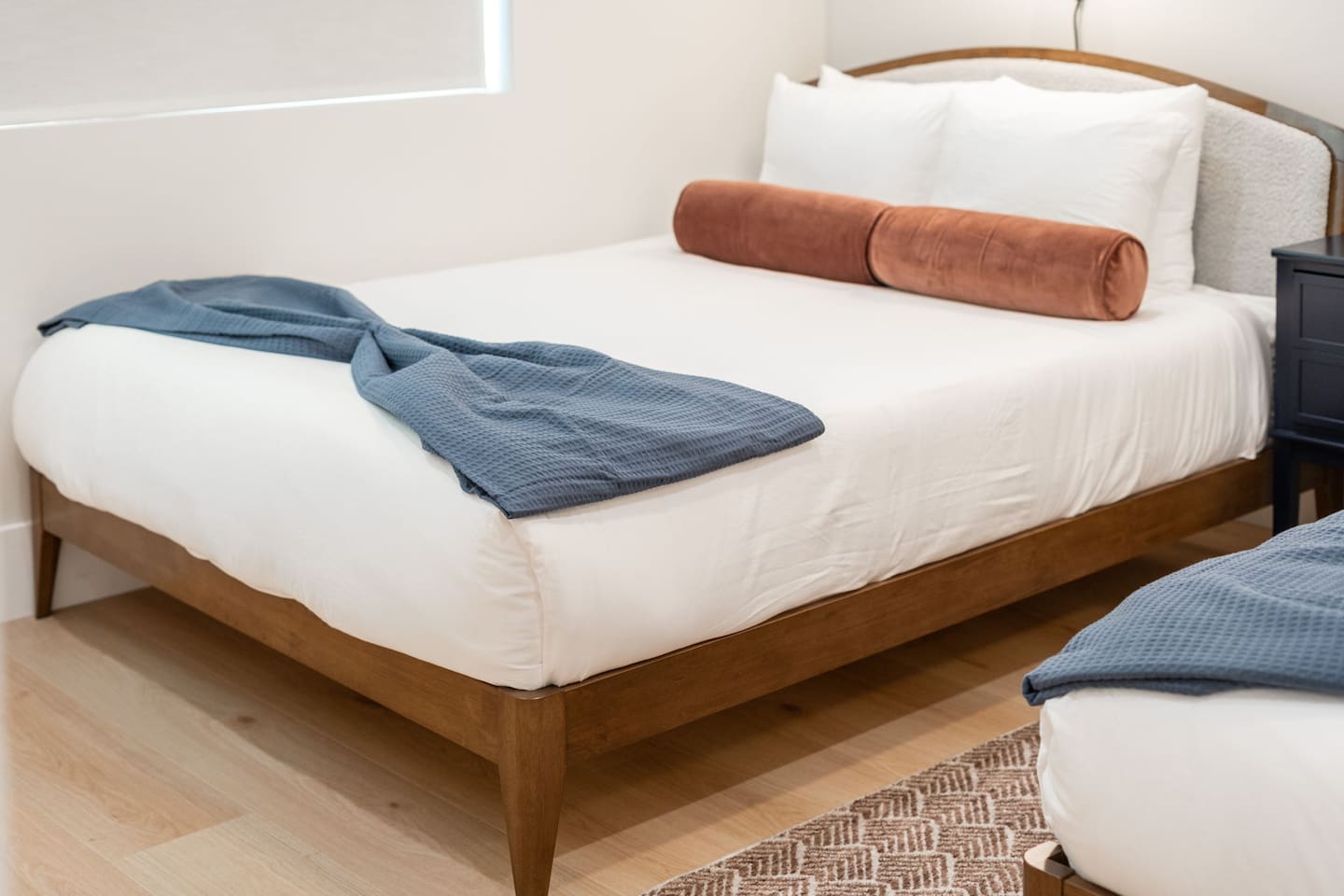 Crisp white bedding with accent pillows and throws add a touch of style and comfort.