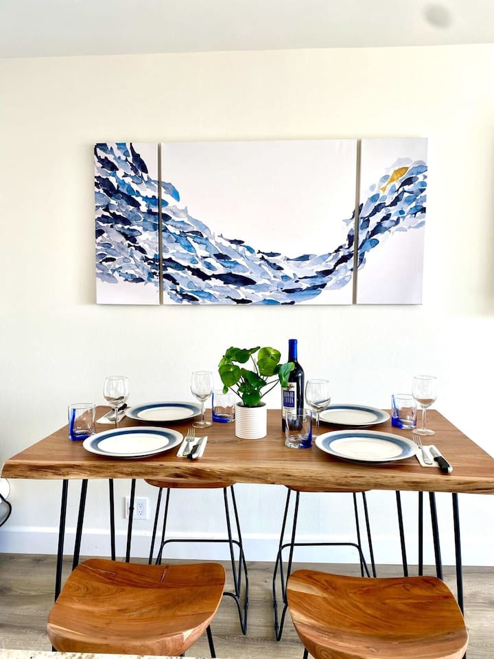 Your dining table is just across from the kitchen island.  Seats four comfortably or  you can choose to dine on the balcony all the same :)