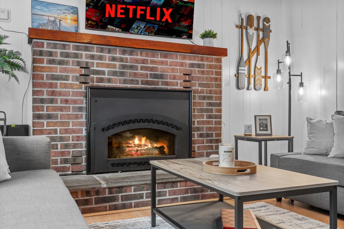 Cozy living room with smart TV and comfy couches