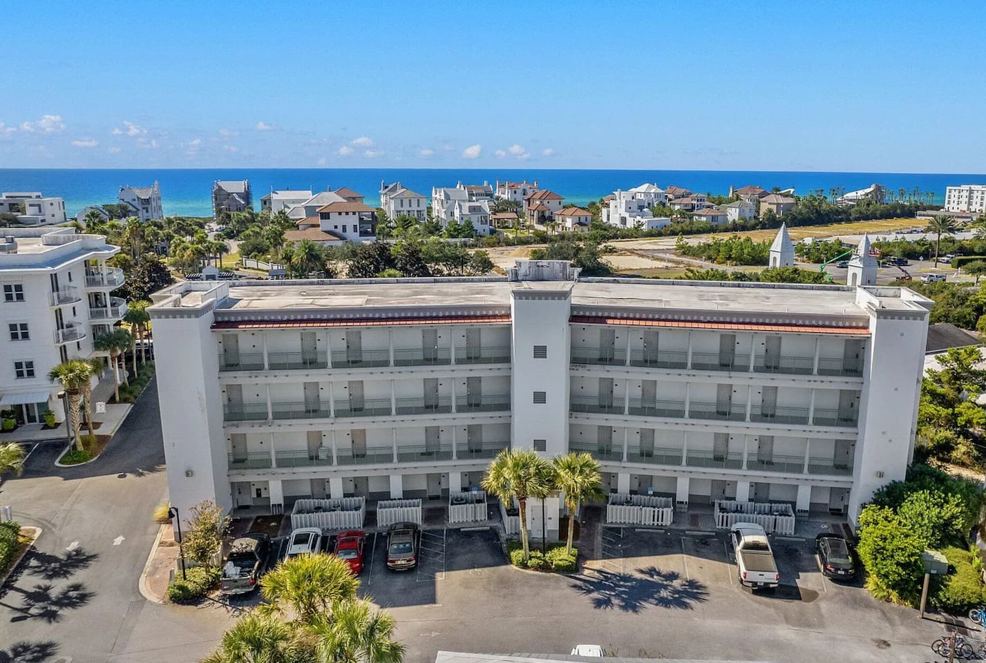 Our studio condo is located on the ground floor for easy access. While it may feel like you're entering from the front, you're actually entering through the back of the building.  This parking lot pictured is the front of the building.  