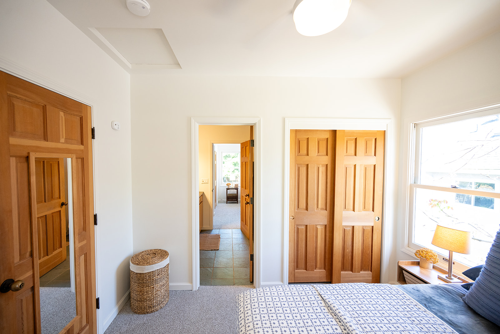 Comfortable bedroom featuring a queen bed, soft linens, and a calm setting for a restful night’s sleep