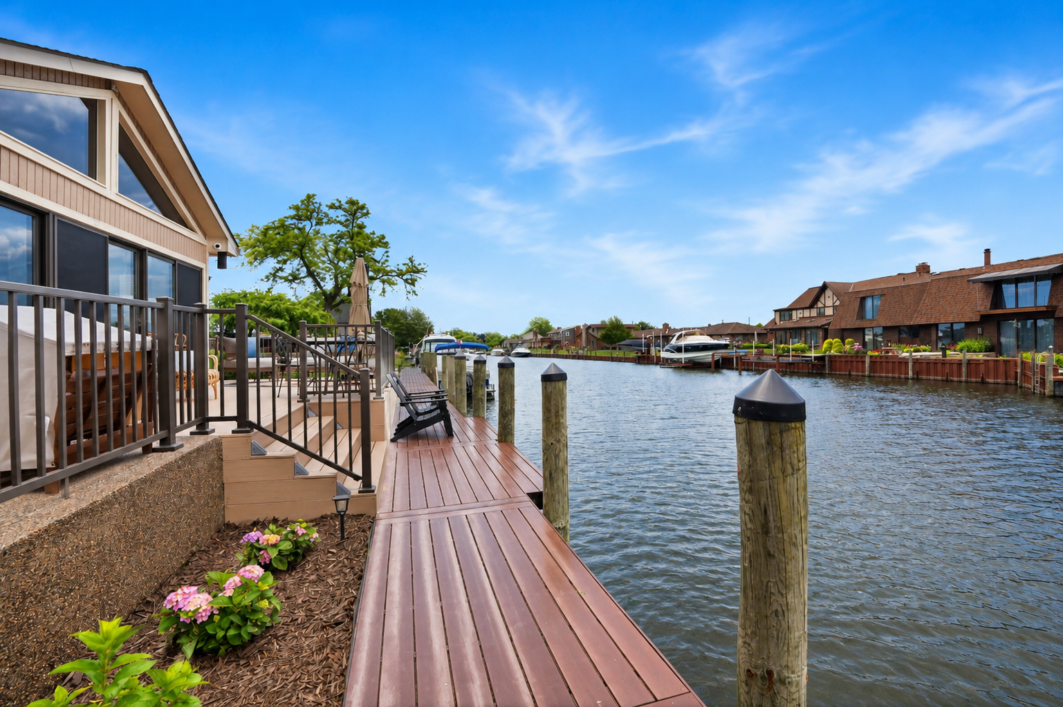 Waterfront boardwalk along a quiet canal with private dock access and scenic neighborhood views perfect for relaxing by the water.