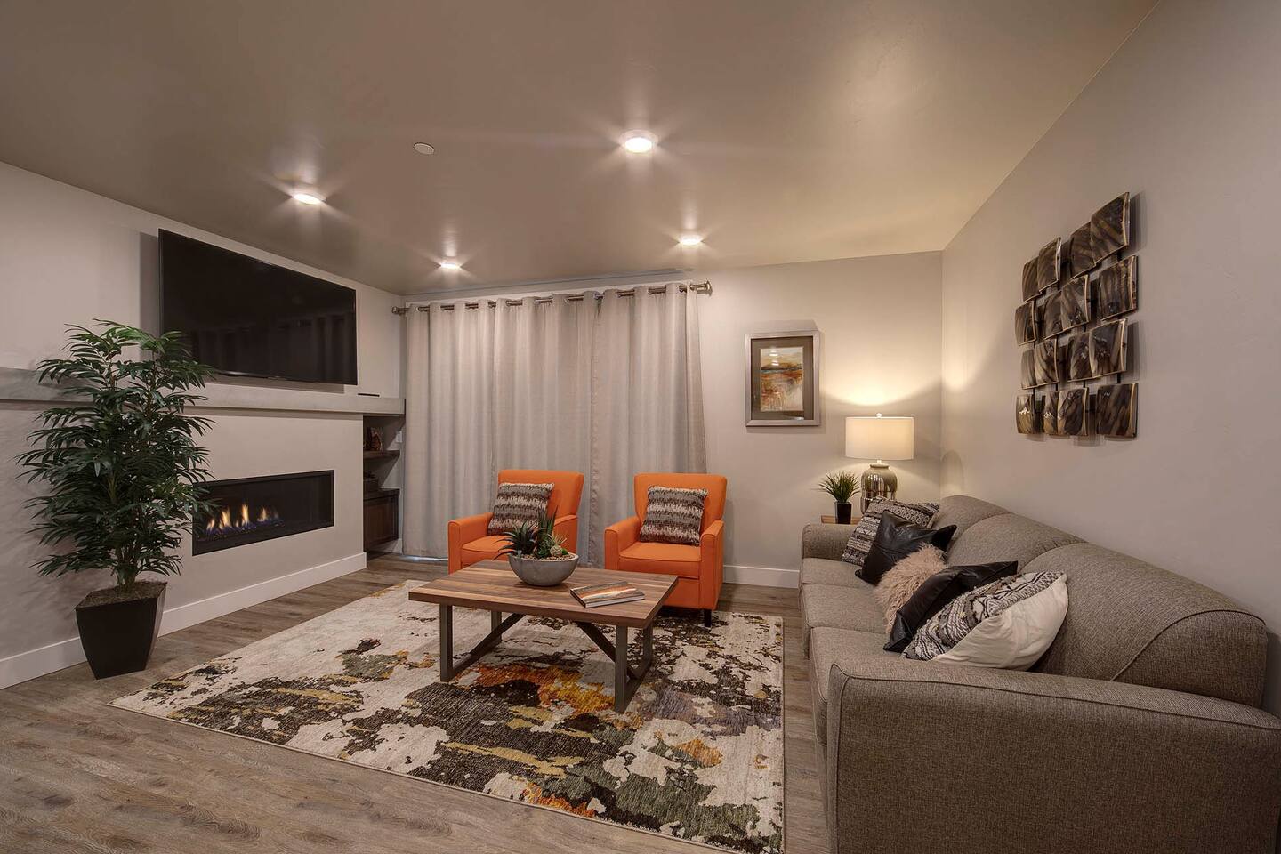 The living area features a fireplace and 65" TV for a great movie night or relaxing in front of the fire.