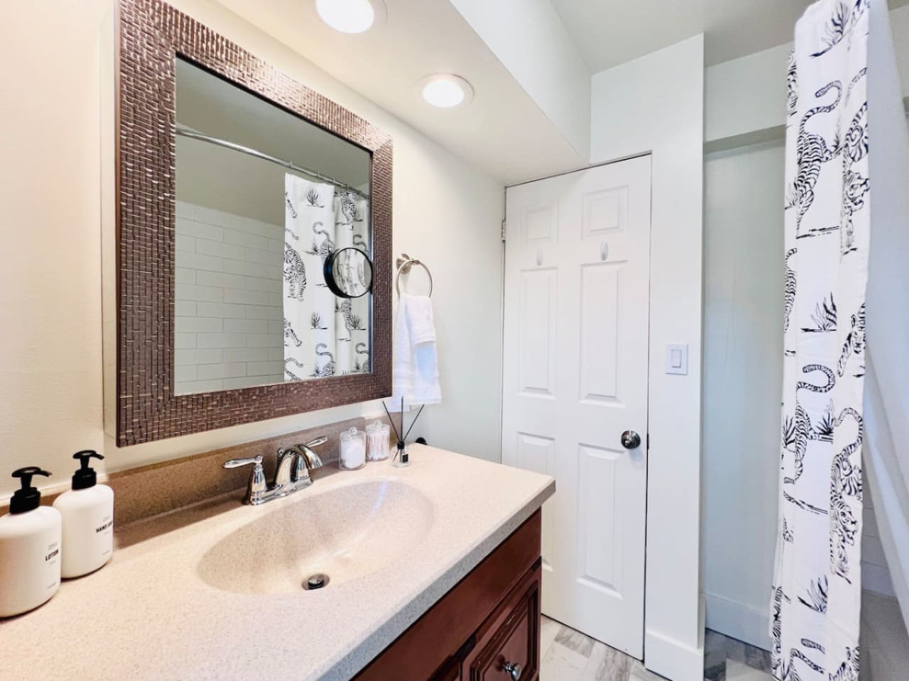 Modern full bathroom, featuring sleek fixtures and all the amenities you need for a comfortable and refreshing experience.