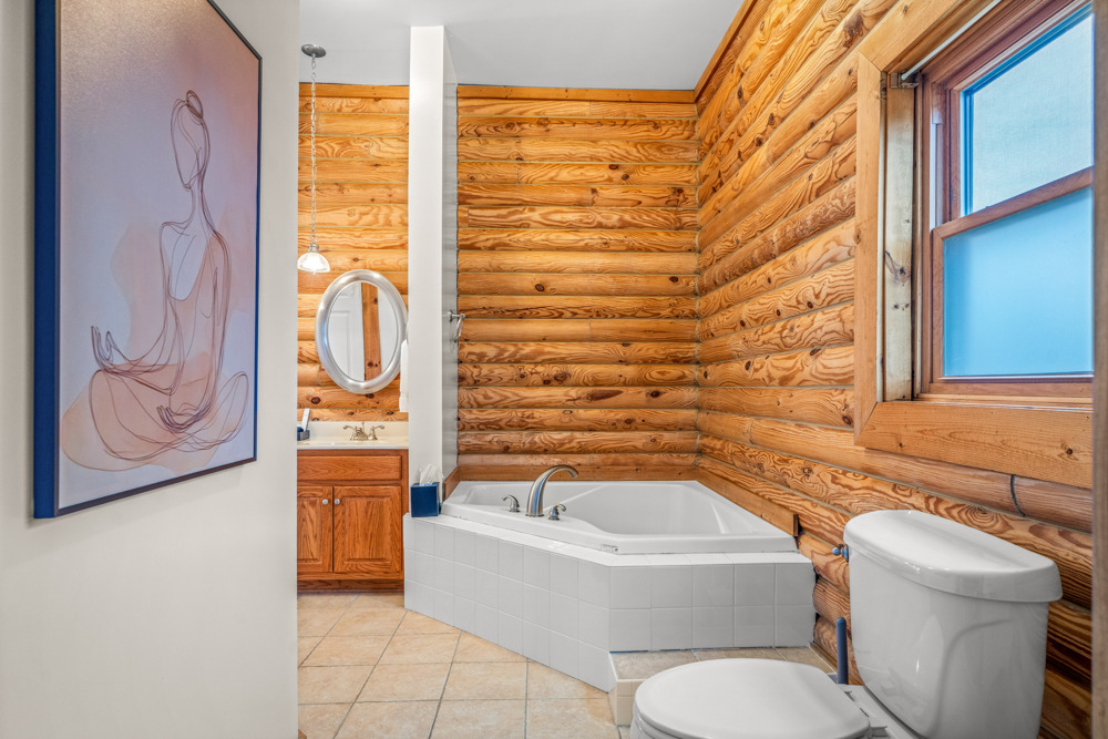End your day with a relaxing soak in the tub surrounded by cozy log cabin charm your own little spa moment.