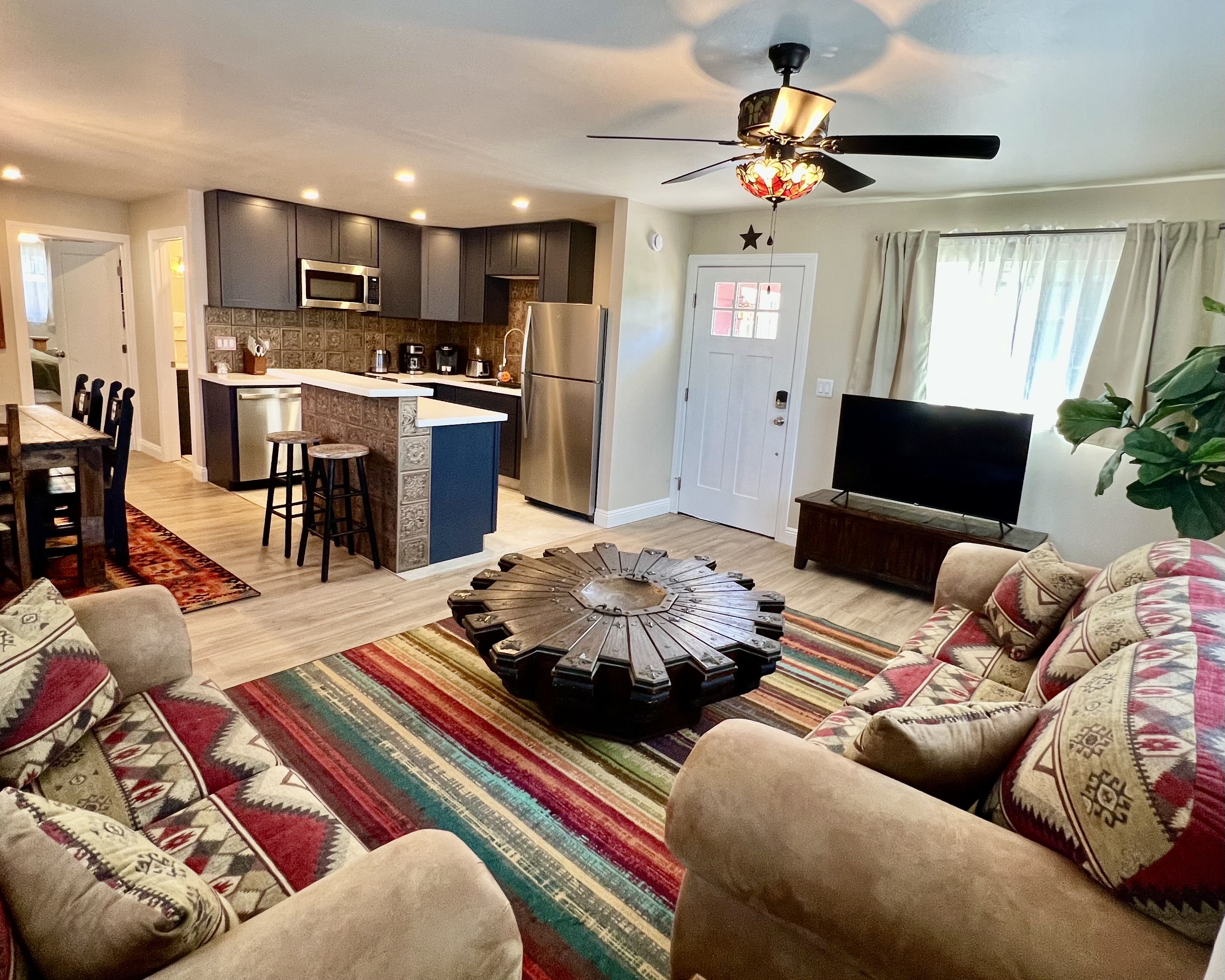 Relax in the spacious, open-concept living room, flowing right into a modern, fully-equipped kitchen. Perfect for gathering!