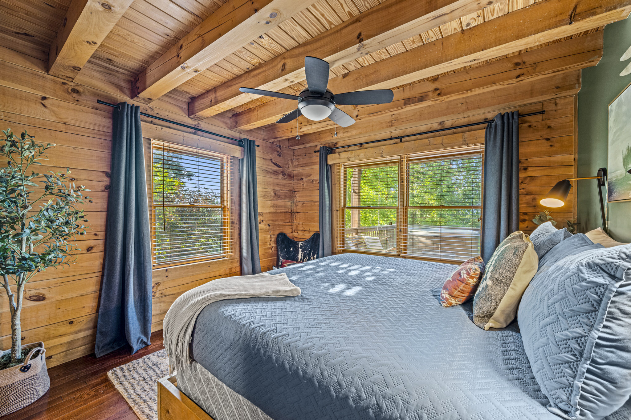 Rest easy in this first floor cozy bedroom; king size bed with plush bedding and peaceful views.