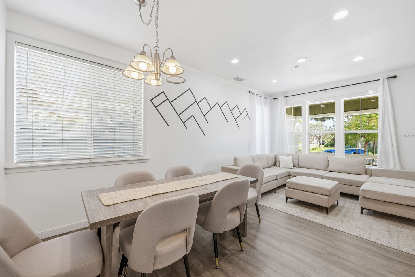 Dining table seats the whole group with pendant lighting and open sightlines to the living room. Ideal for family meals. 4-bedroom beach house near Channel Islands Harbor.