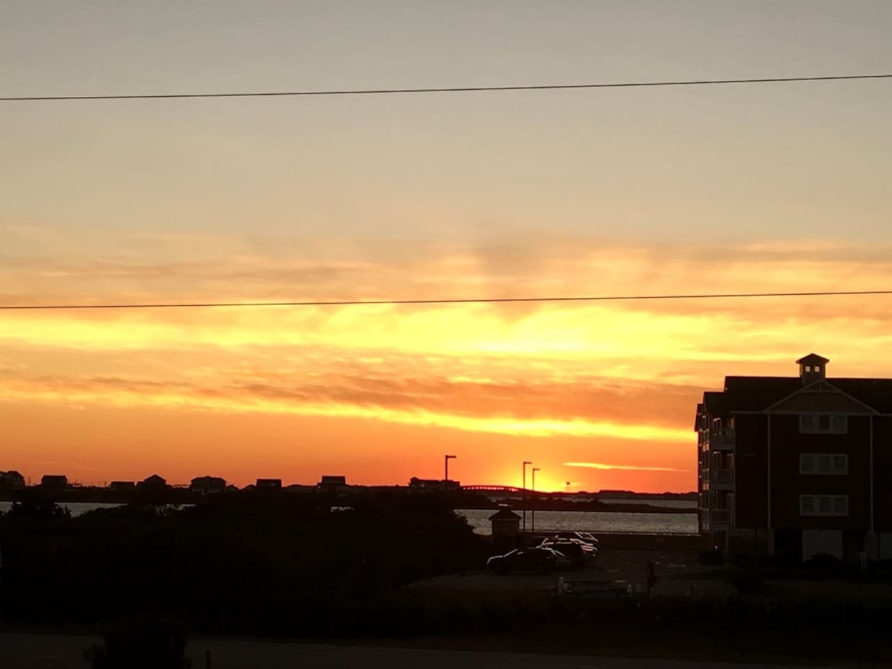 Enjoy the beautiful OBX Bay Sunsets from your balcony!