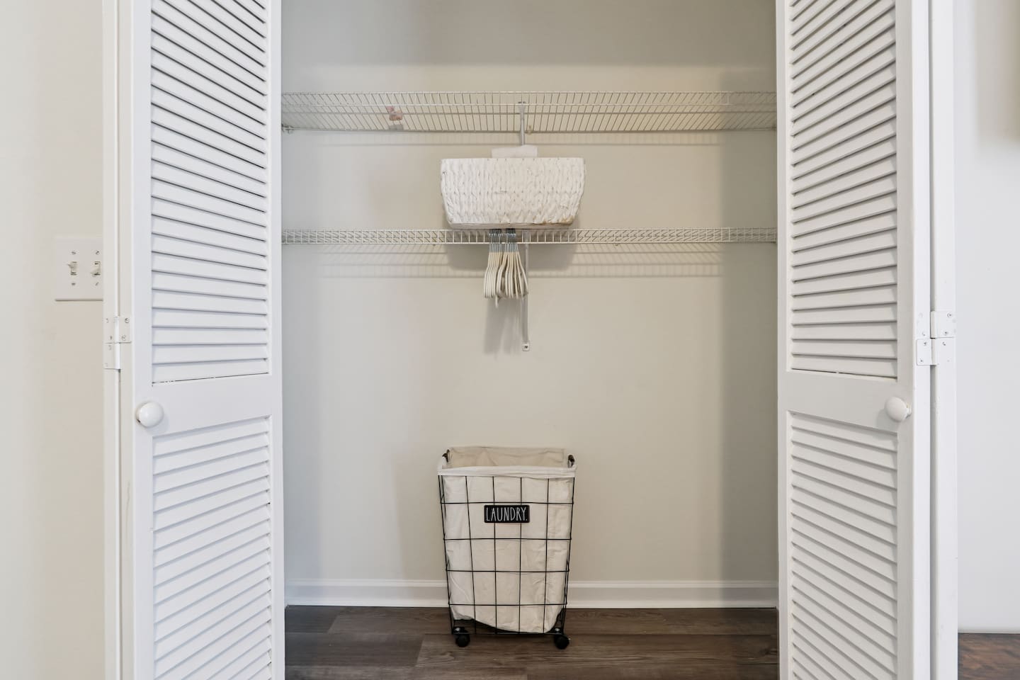 Master bedroom featuring a comfortable king bed and an Amazon Fire-powered Smart TV. The shared bathroom is conveniently right next door. This room includes 2 full-body towels, 2 washcloths, and 2 hand towels for your stay.
