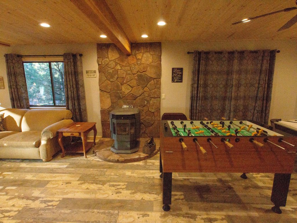 Game room pellet stove with Moss Rock background, showing  pro foos ball table