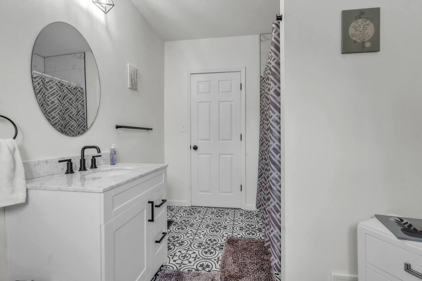 Full bathroom with a relaxing bathtub, perfect for unwinding and enjoying a soothing soak.
