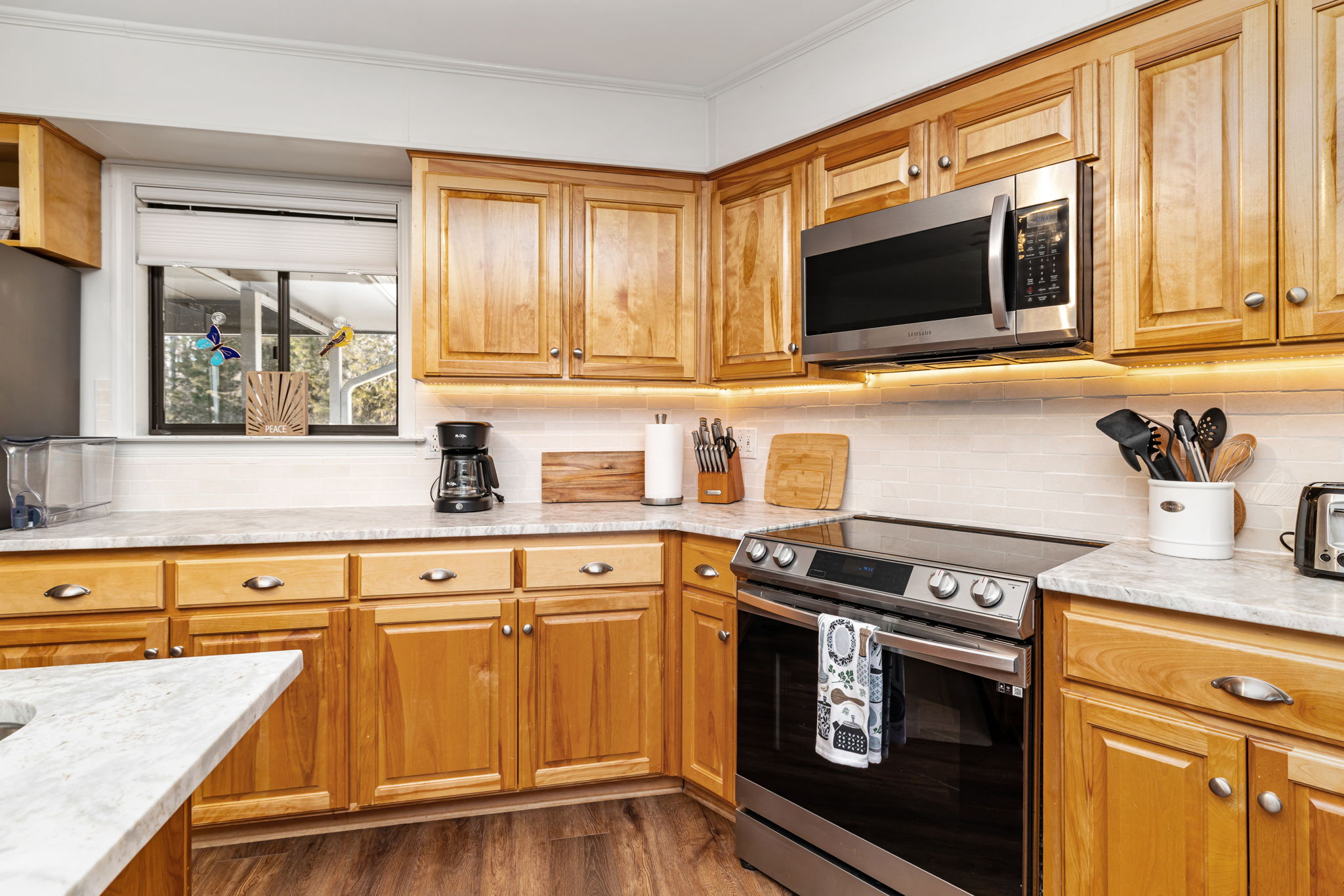 Kitchen: Modern appliances and sunny views await your culinary adventures!