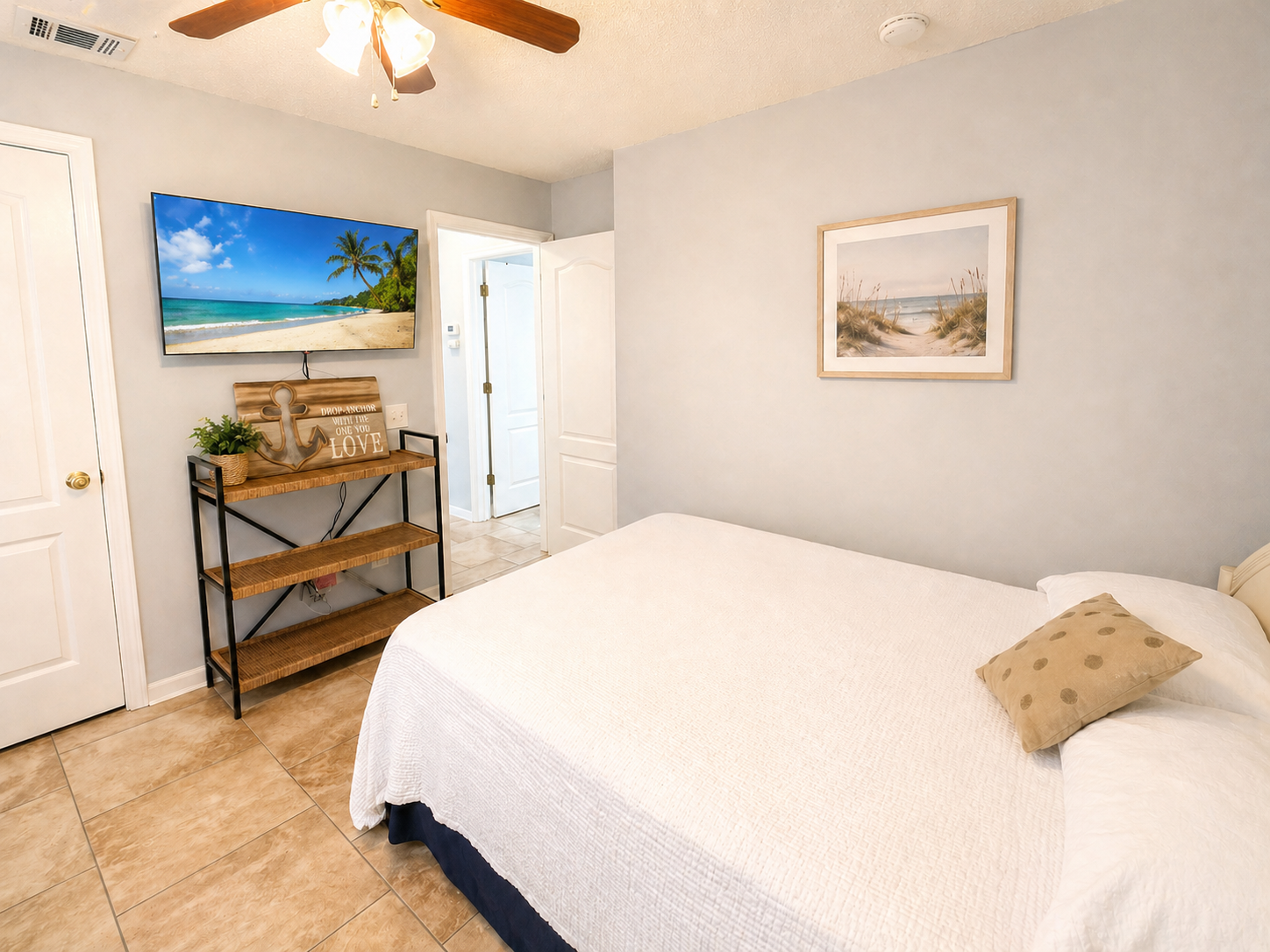 Main-level bedroom with flatscreen TV