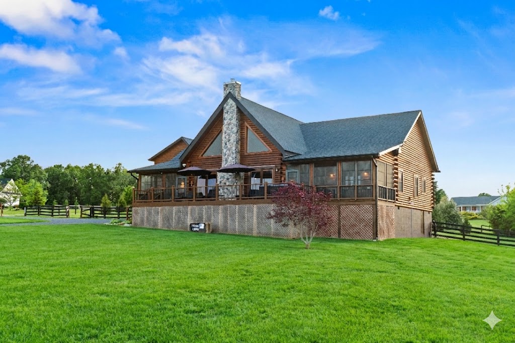 This stunning log cabin retreat blends rustic charm with modern comfort, offering scenic serenity, expansive outdoor space, and unforgettable mountain views.