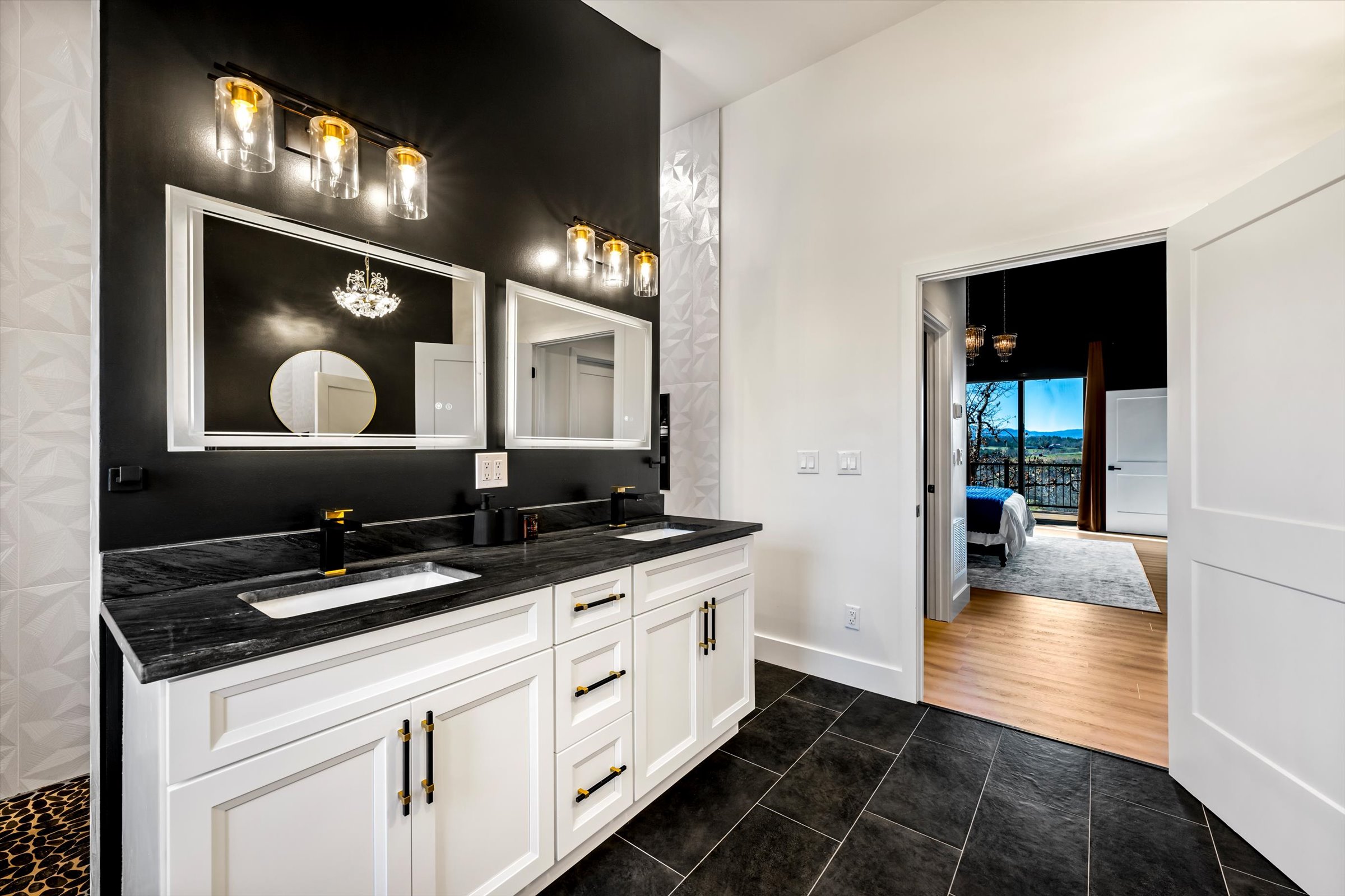 {Primary Bathroom}
Double vanity, noir finishes, and space to get ready without rushing — designed for both function and ease.