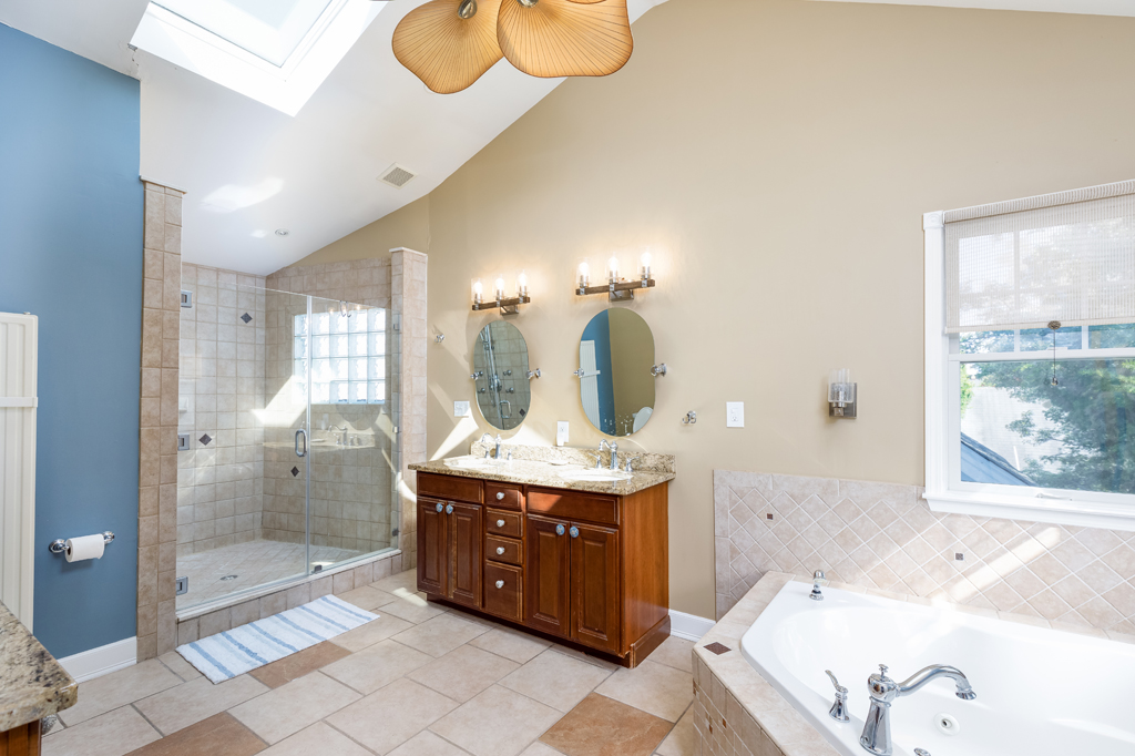 Enjoy this walk-in shower & double vanity in the upstairs bathroom that "is impeccable" as stated by guest Josie.