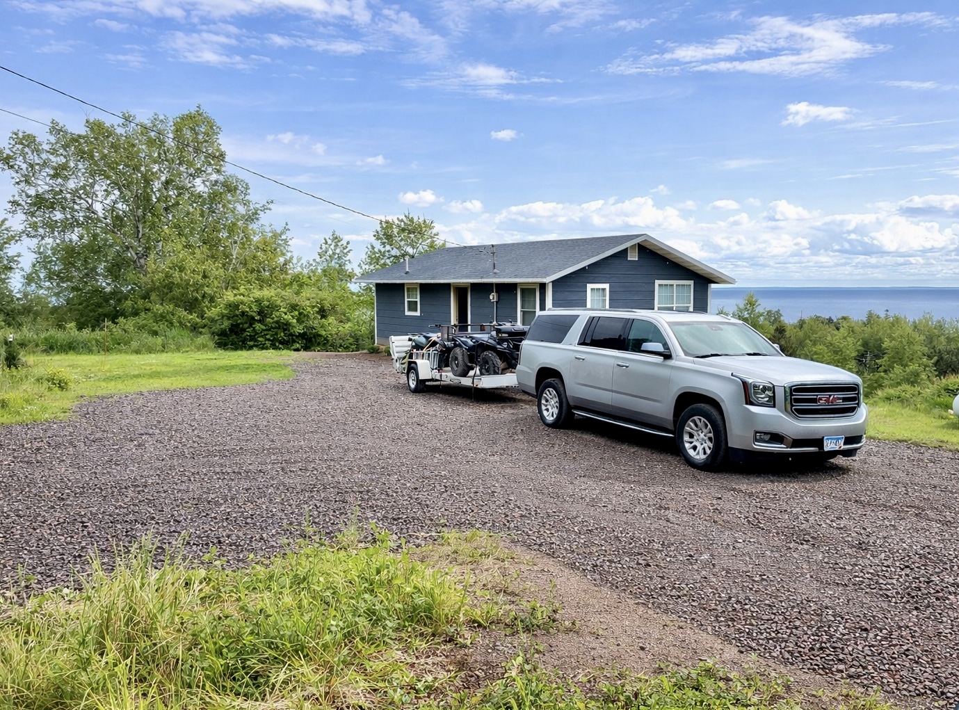 Spacious private parking with room for large vehicles, trucks, and trailers, perfect for ATV, snowmobile, and biking adventures. White Rock offers plenty of space to unload and gear up, with nearby trail access for year-round outdoor fun!