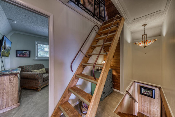 Climb the stairs to your cozy attic bedroom, a peaceful and private retreat away from it all.