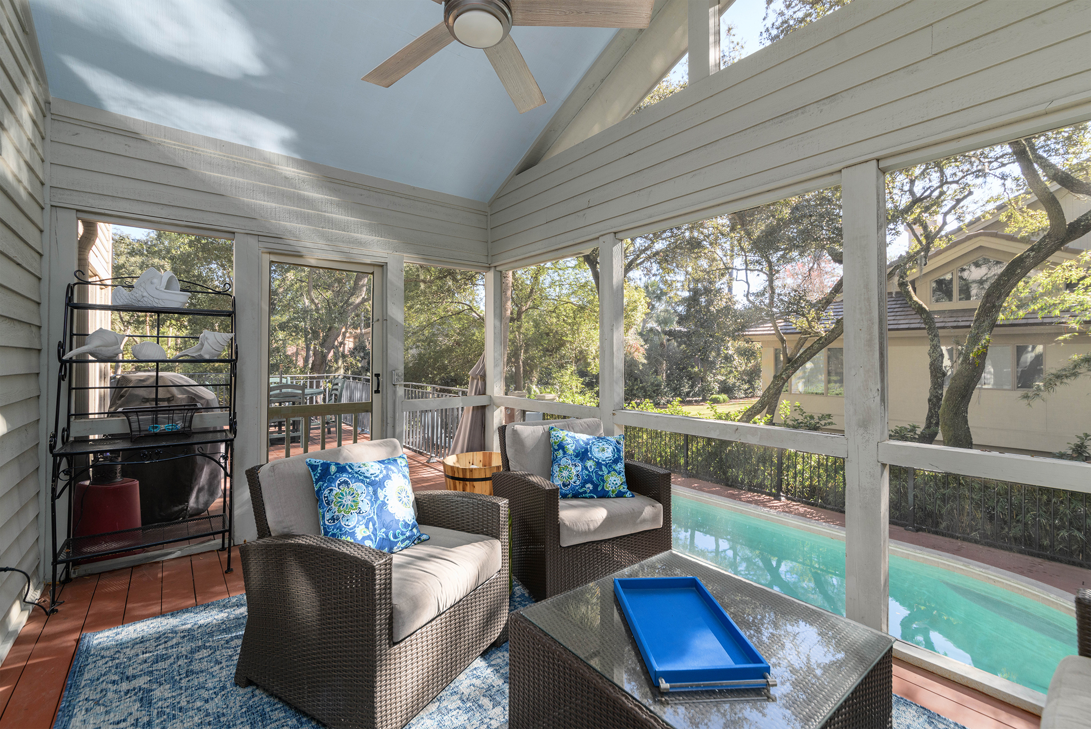 Screen porch overlooking pool