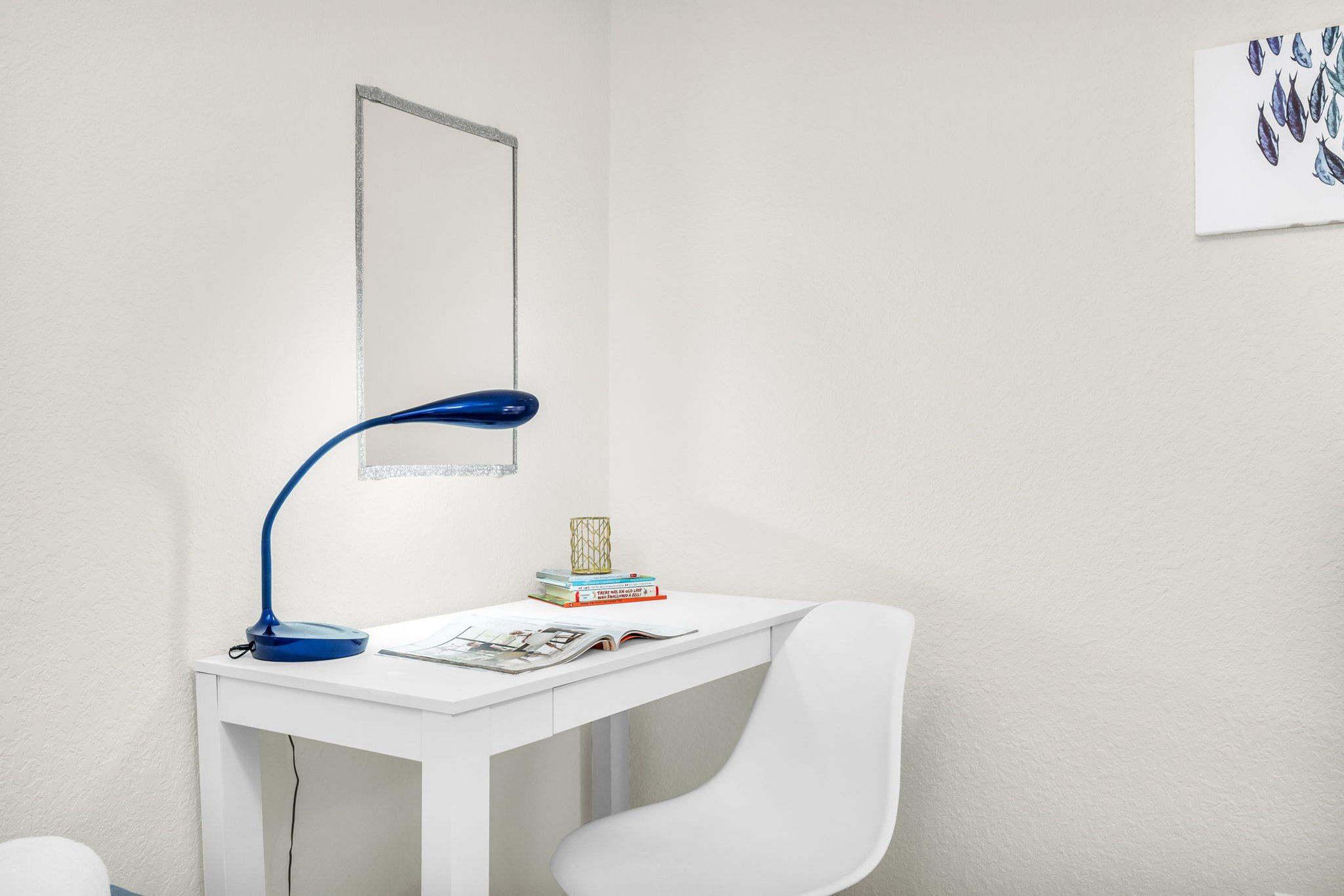 Family-friendly twin bedroom featuring two plush twin beds, coastal décor, and a convenient desk area for work or study.