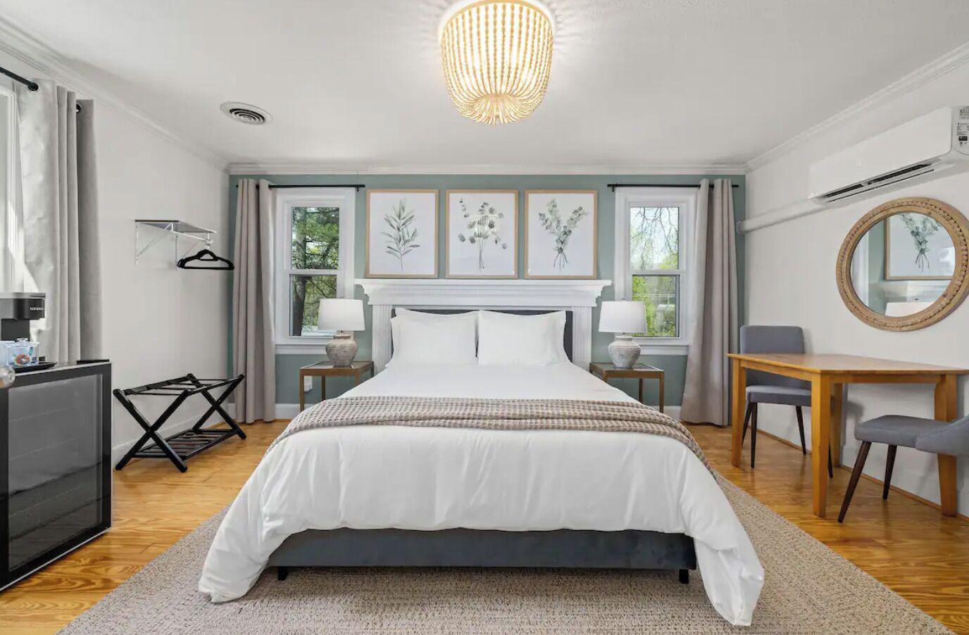 Eucalyptus Suite Bedroom #1 includes queen bed, dresser, TV, mini fridge & table