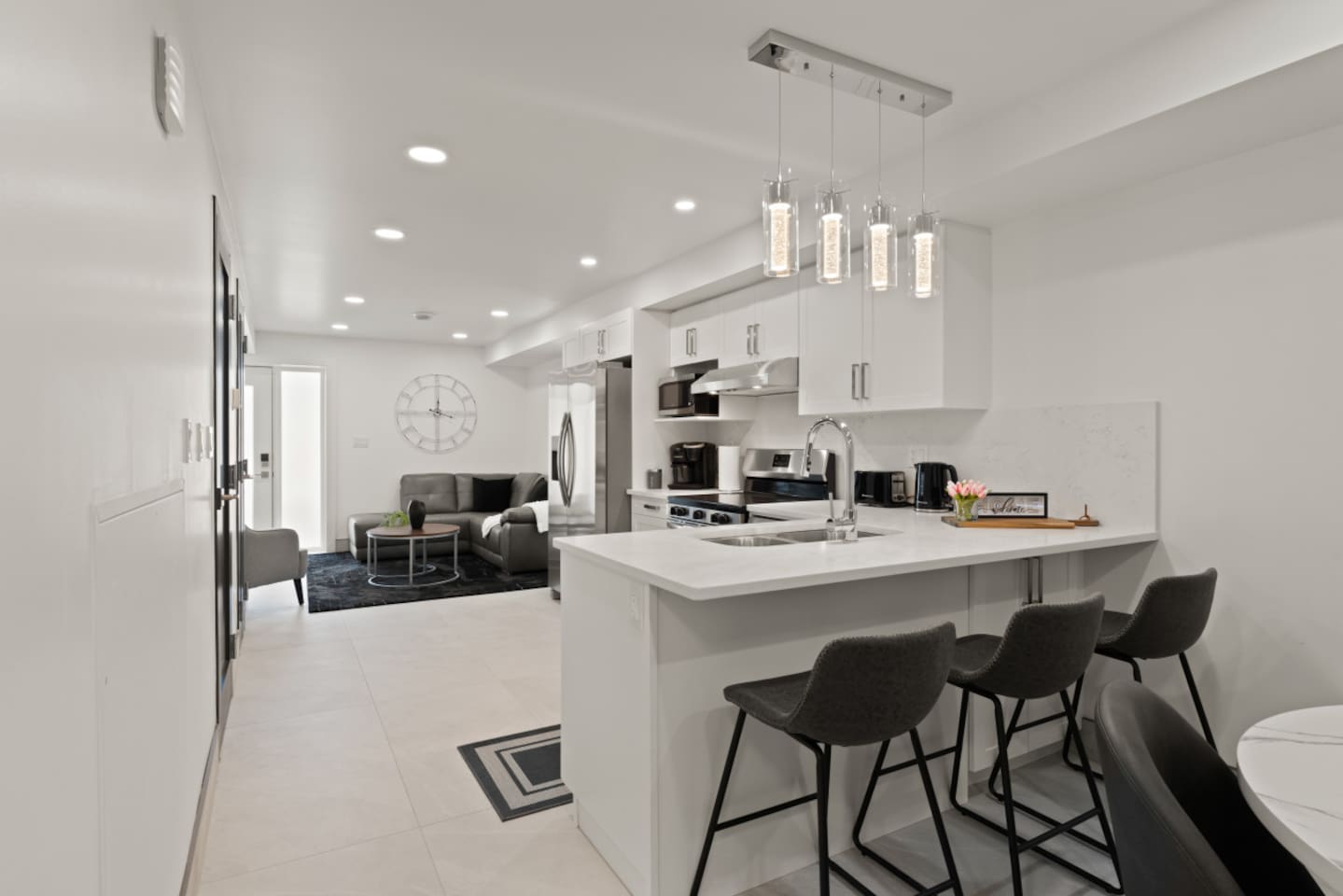 The open concept design takes advantage of creating a smooth transitions from the dining area to the kitchen with an eat-in counter top bar.