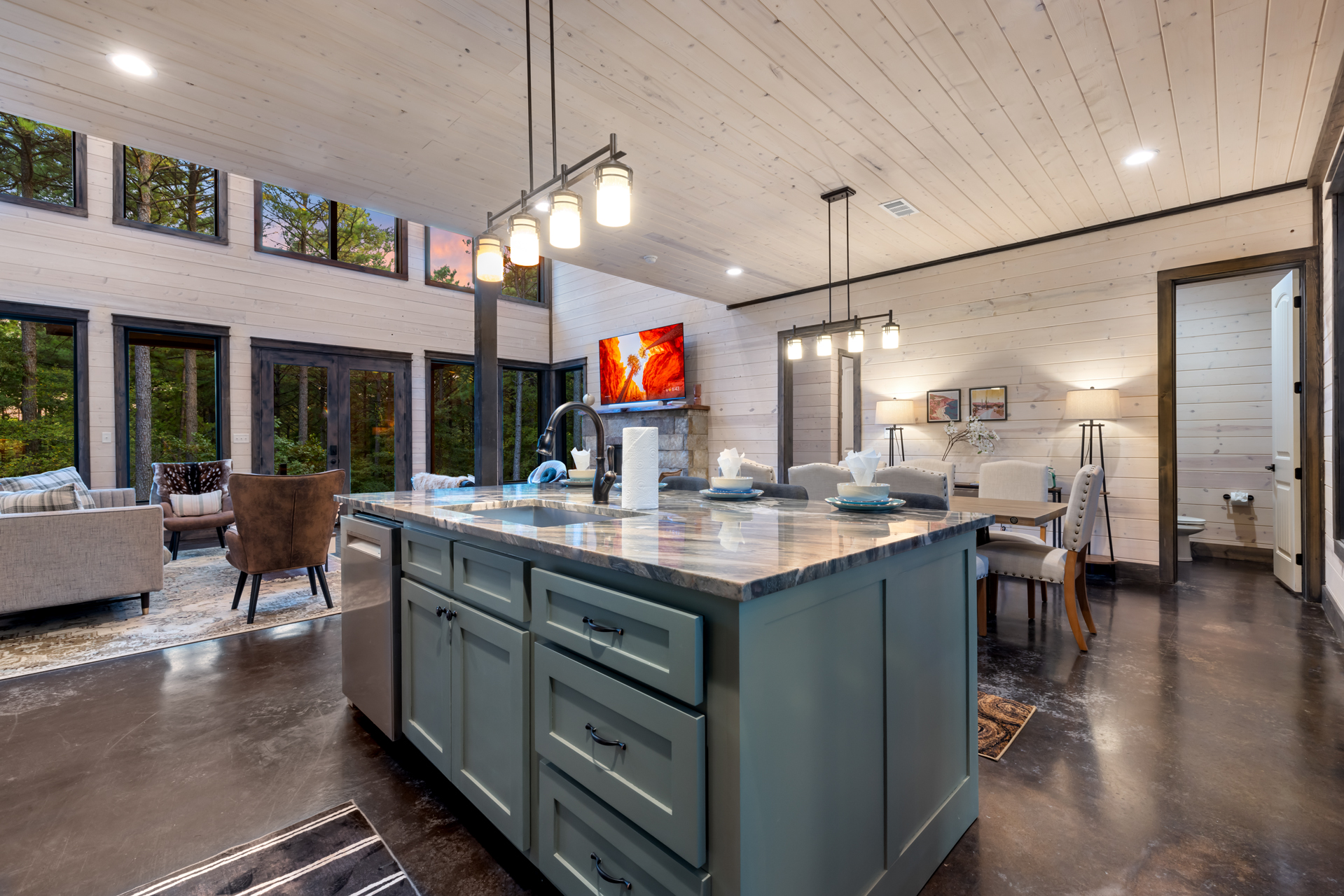 Spacious kitchen island with seating for four, perfect for casual meals, morning coffee, or gathering while cooking together.
