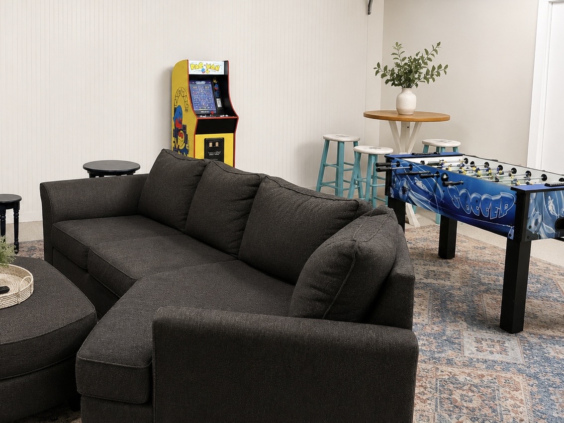 Cozy game room with Pac-Man, foosball, and plenty of space to hang out!